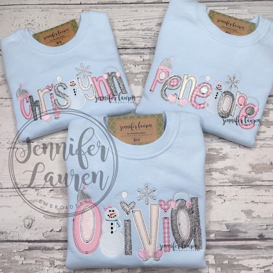 Light blue snow name shirt or sweatshirt