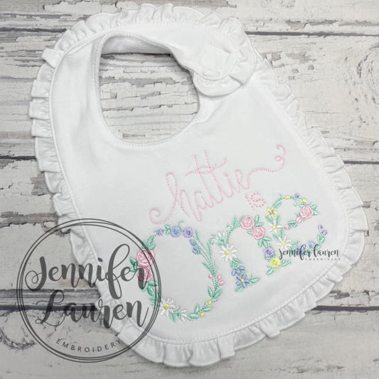 Floral ONE ruffle bib